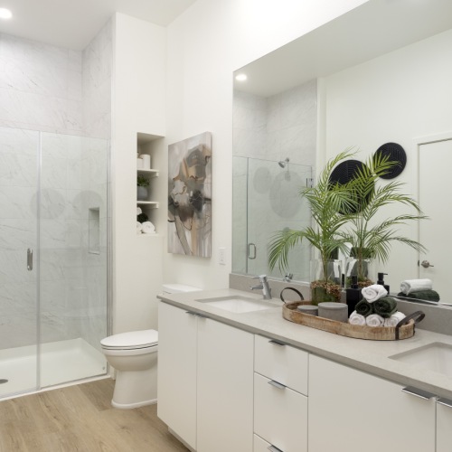 a bathroom with a sink toilet and a mirror